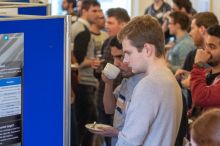 Participants at the 2019 SUPA-Cormack meeting read research posters